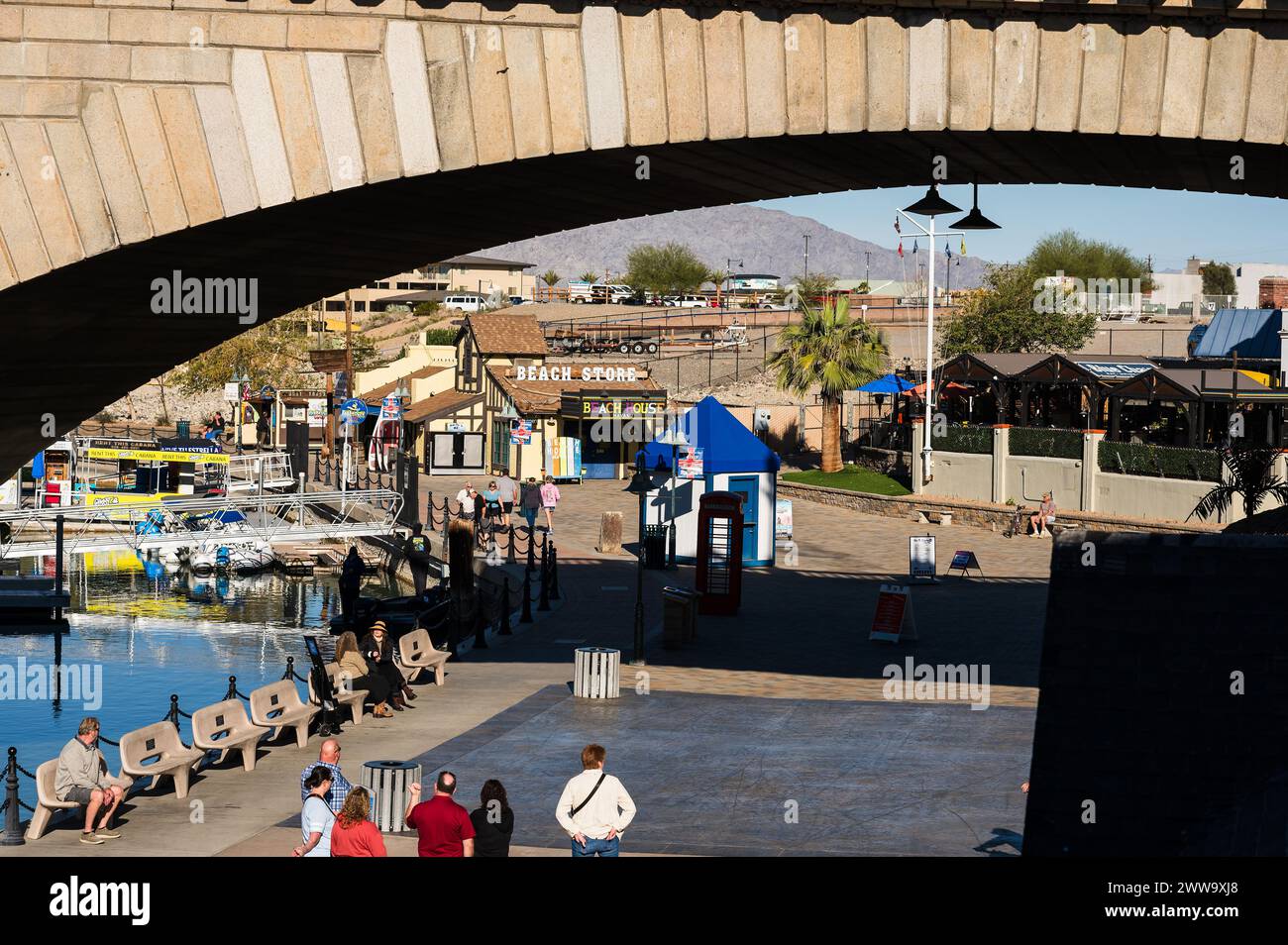 Tourists near the old London Bridge, which was relocated from London England in the 1970’s to Lake Havasu Arizona. Stock Photo