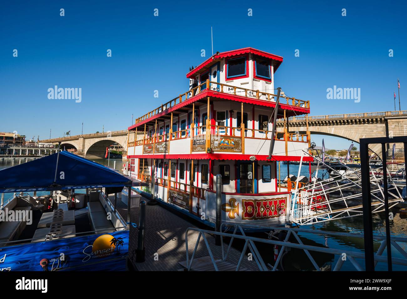 Tour boats near the old London Bridge, which was relocated from London England in the 1970’s to Lake Havasu Arizona. Stock Photo