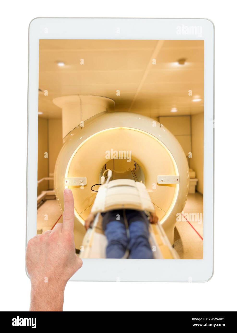 A patient lies down comfortably on the MRI scanner, undergoing a relaxing MRI scan to assess the upper abdomen on tablet isolated on white background. Stock Photo