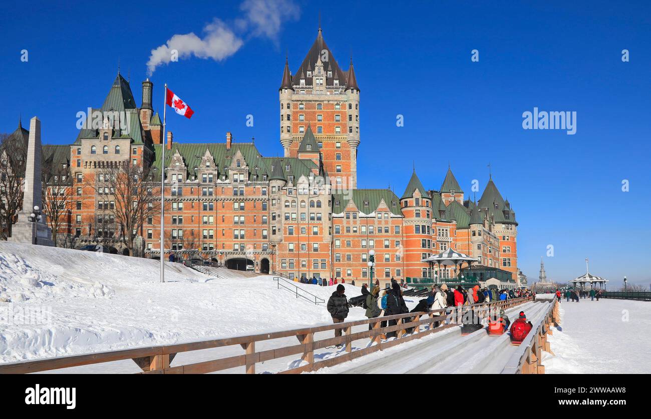 Traditional slide ride in winter in Quebec City with Frontenac Castle on the background, Canada Stock Photo