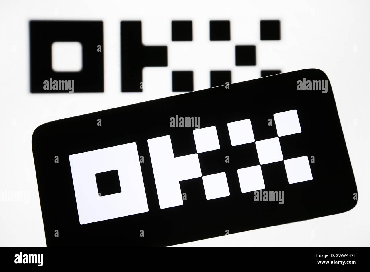 Kyiv, Ukraine. 22nd Mar, 2024. In this photo illustration, OKX Crypto Exchange logo is seen on a smartphone and a pc screen. (Photo by Pavlo Gonchar/SOPA Images/Sipa USA) *** Strictly for editorial news purposes only *** Credit: Sipa USA/Alamy Live News Stock Photo