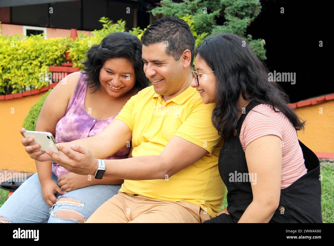 Divorced single dad with his dark-skinned Latino teenage daughters ...