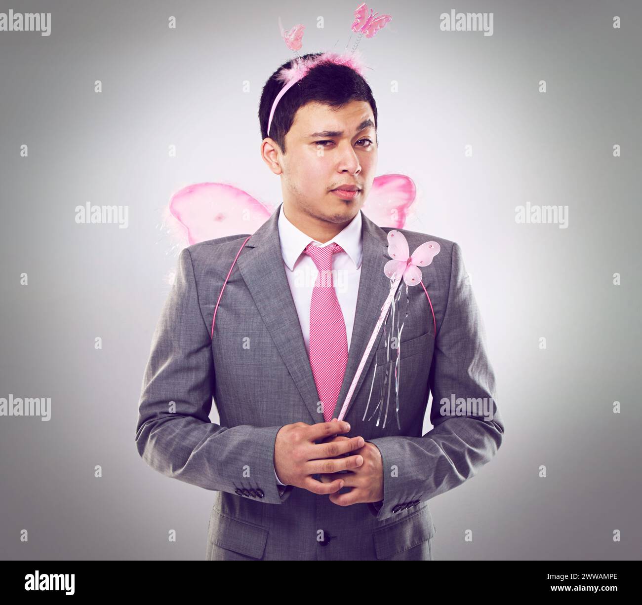 Business man, fairy costume and portrait with magic in corporate for career  growth on grey background. Butterfly, wand and wings, fantasy cosplay for  Stock Photo - Alamy
