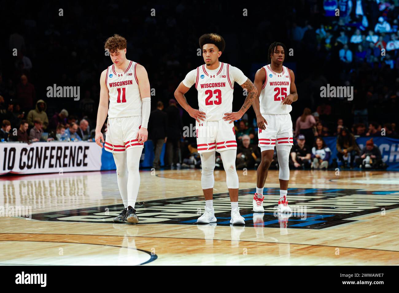 Brooklyn, NY, USA. 22nd Mar, 2024. Wisconsin Badgers guard Max Klesmit (11), guard Chucky Hepburn (23), and guard John Blackwell (25) during the NCAA Men's March Madness Round One Tournament basketball game between the James Madison Dukes and the Wisconsin Badgers at the Barclays Center in Brooklyn, NY. Darren Lee/CSM/Alamy Live News Stock Photo