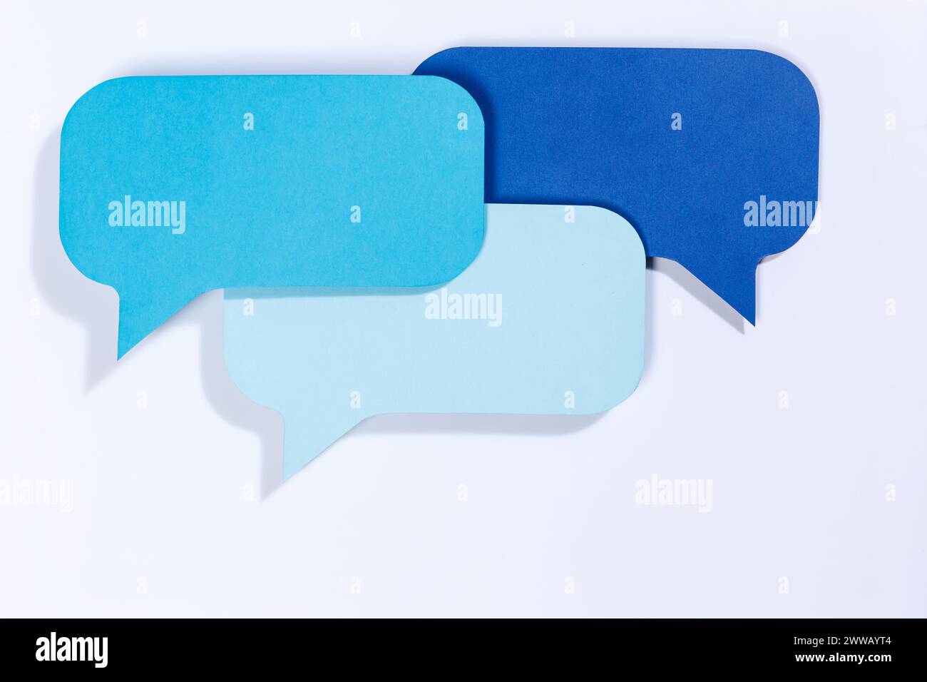 Blue speech bubbles with copyspace copy space communication information concept talking info Stock Photo