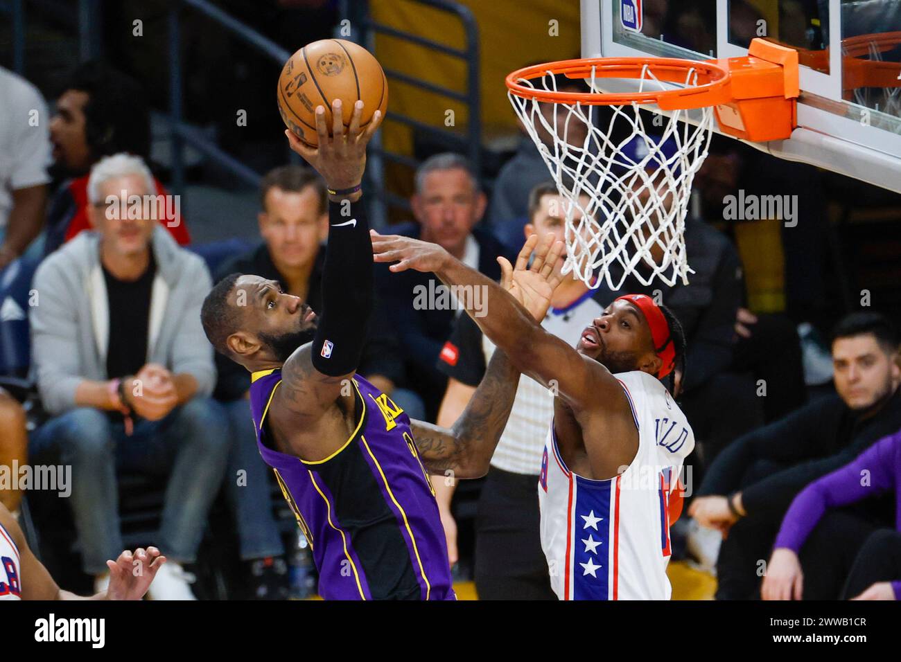 Los Angeles, United States. 22nd Mar, 2024. Los Angeles Lakers' LeBron James (L) and Philadelphia 76ers' Buddy Hield (R) seen in action during an NBA basketball game between Lakers' and 76ers at Crypto.com Arena. Final Score ( NBA 2024:) Lakers 101:94 76ers (Photo by Ringo Chiu/SOPA Images/Sipa USA) Credit: Sipa USA/Alamy Live News Stock Photo