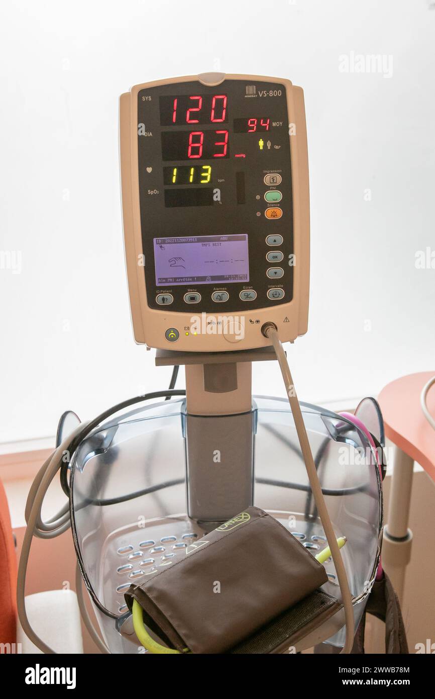 Blood pressure monitor in hospital for measuring patients blood pressure. Stock Photo