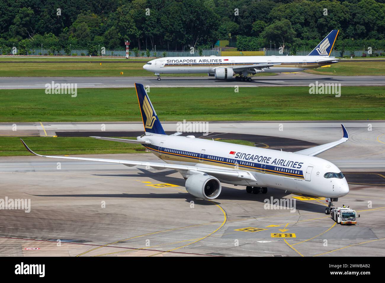 Changi, Singapore - February 3, 2023: Singapore Airlines Airbus and Boeing airplanes at Changi Airport (SIN) in Singapore. Stock Photo