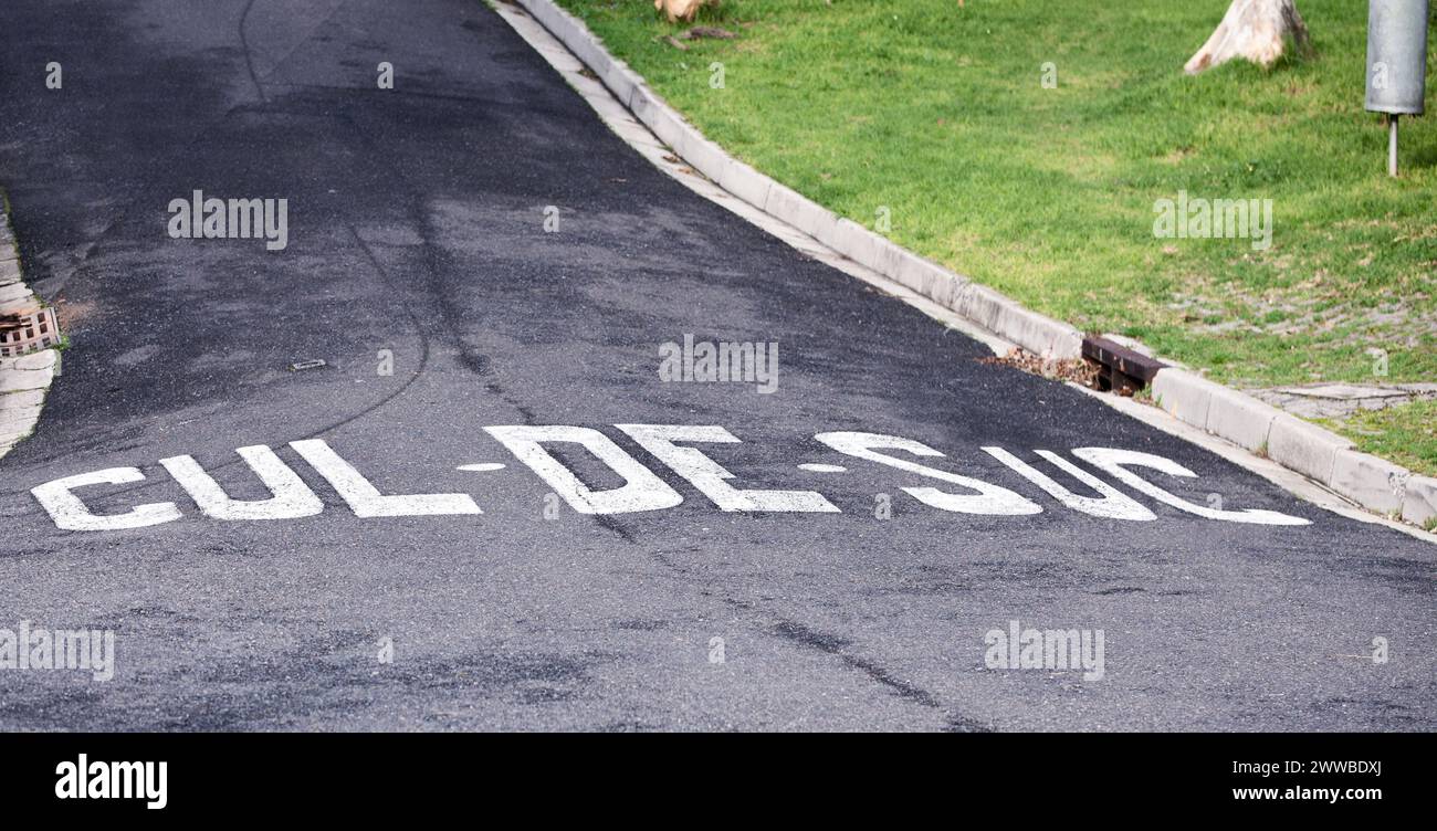 Cul de sac, road and outdoor with sign for warning with mistake, joke or comic text in neighborhood. Asphalt, error and funny signage with writing Stock Photo