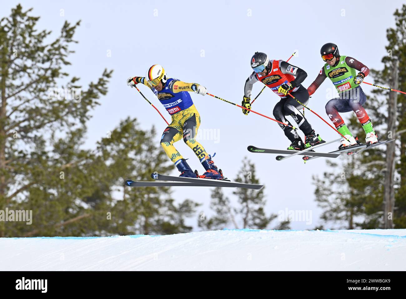 Idre, Sweden. 23rd Mar, 2024. Florian Fischer (blue), Germany, Oliver Davies (red), Great Britain and Gavin Rowell (green), Canada in action in the qualifying heat 1 during the FIS World Cup ski cross competitions at Idre Fjäll, Sweden Marsch 23, 2024. Photo: Anders Wiklund/TT/Code 10040 Credit: TT News Agency/Alamy Live News Stock Photo