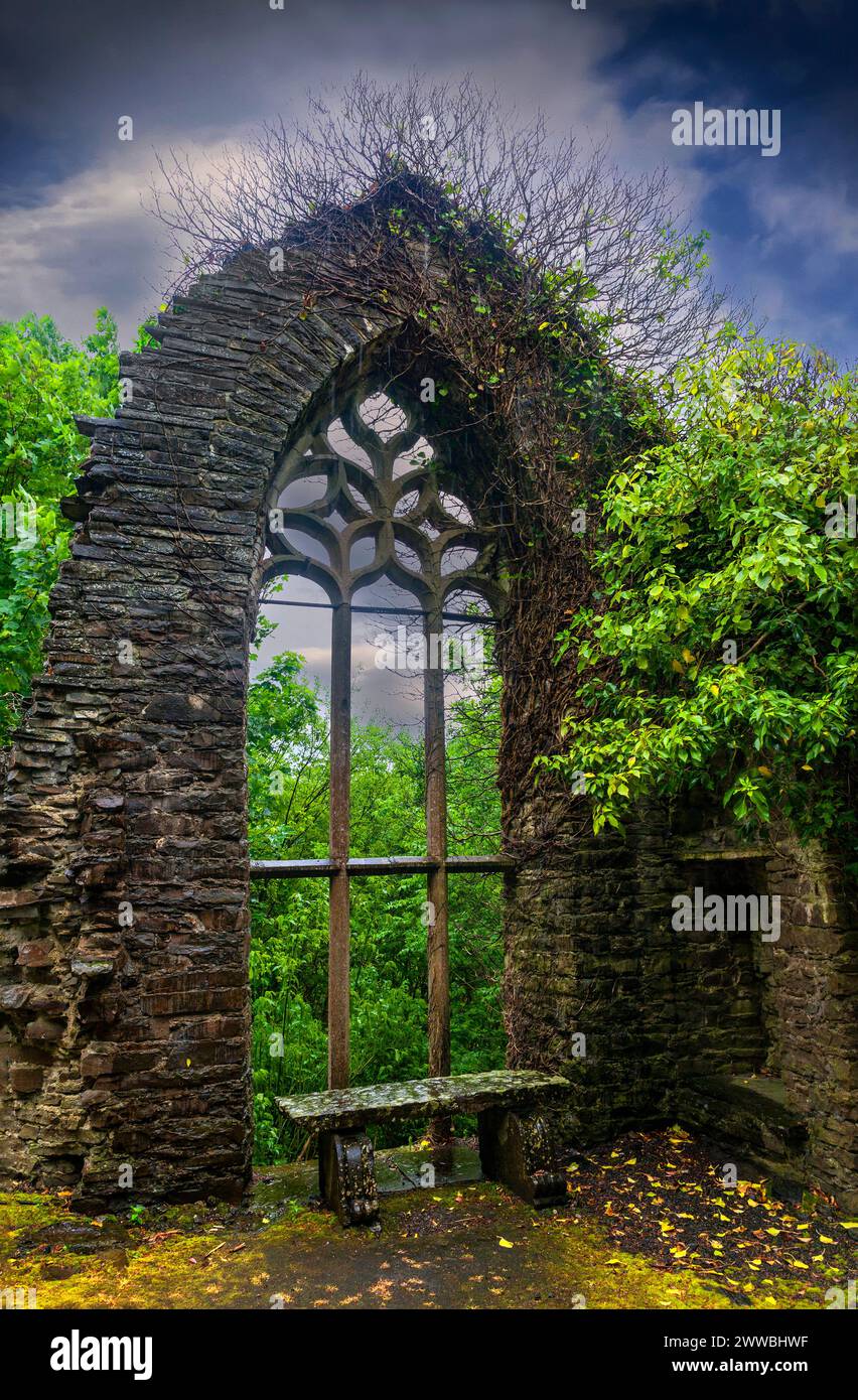 A recycled abbey window in the 'Italian Gardens' at Heywood at Ballinakill in County Laois, Ireland, designed by Sir Edwin Lutyens in 1912. Stock Photo