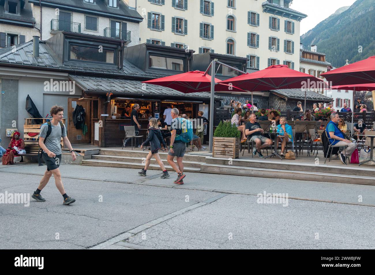 People in an outdoor cafè in the centre of the alpine village in summer, Chamonix, Haute Savoie, Auvergne Rhone Alpes, France Stock Photo