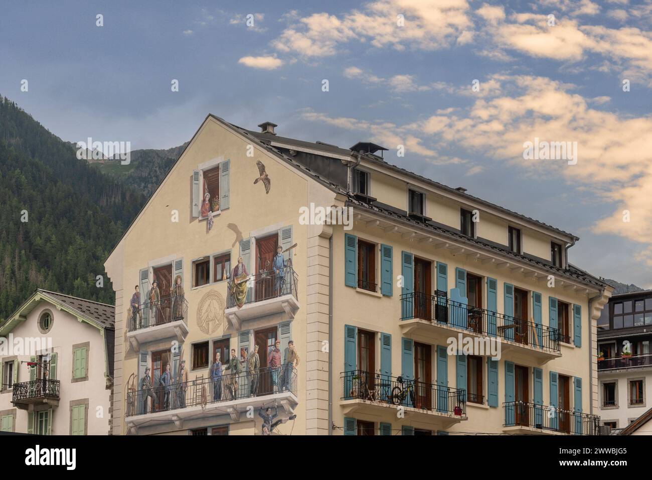 High section of a buildind with a giant mural depicting some of the ...