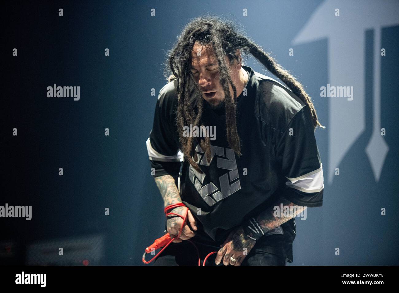 P.O.D. performing live at Wembley Arena, London on 15 March 2024 Sonny Sandoval ,lead singer P.O.D. (an initialism for Payable on Death) is an American Christian nu metal band formed in '92. They have sold over 12 million records worldwide. Over the course of their career, the band has received three Grammy Award nominations, contributed to numerous motion picture soundtracks and toured internationally. With their third studio album, The Fundamental Elements of Southtown, they achieved their initial mainstream success; the album was certified platinum. Stock Photo