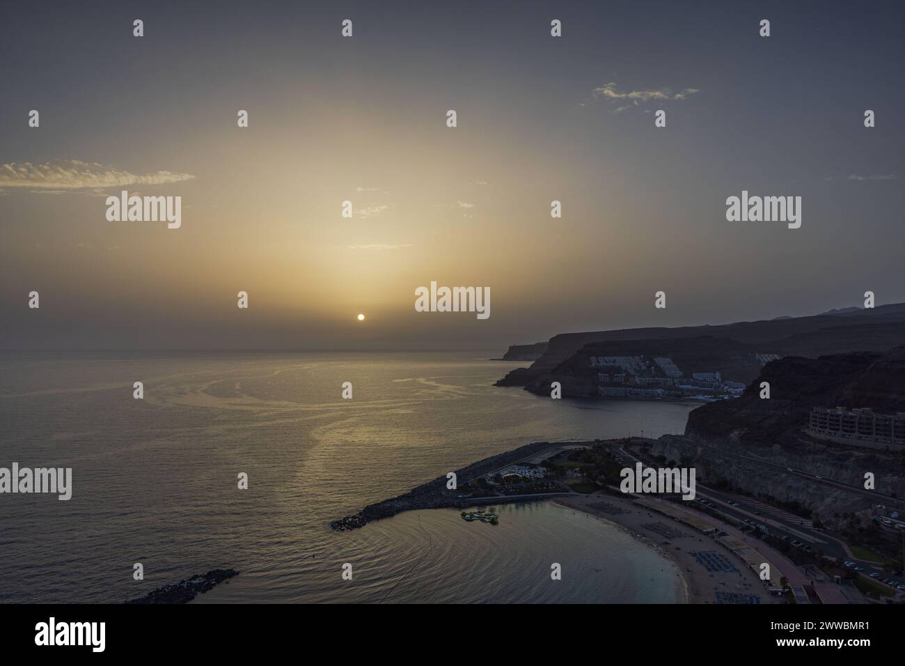 Gorgeous sunset casting its warm glow over the Atlantic Ocean, offering ...