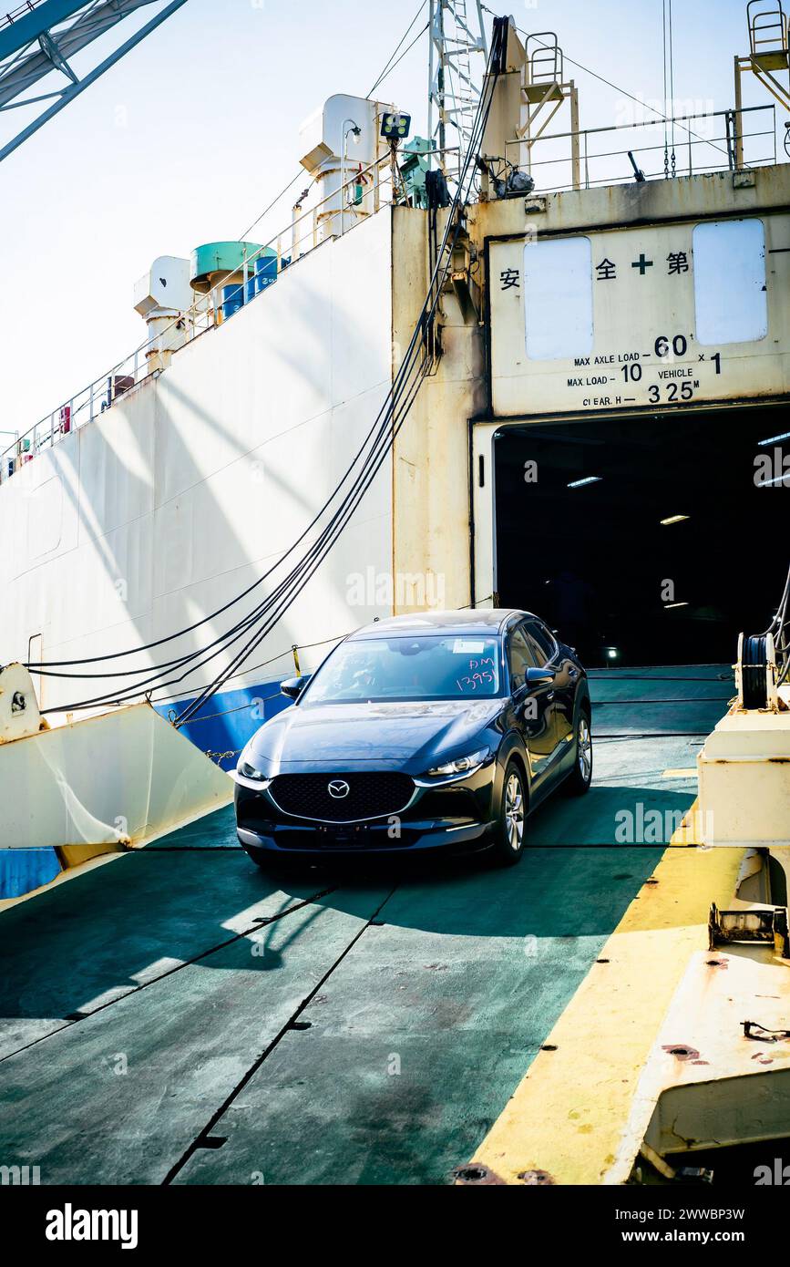 Vladivostok, Russia - 3 March 2024: unloading of new car from the ship in sea port of Vladivostok, Russia Stock Photo
