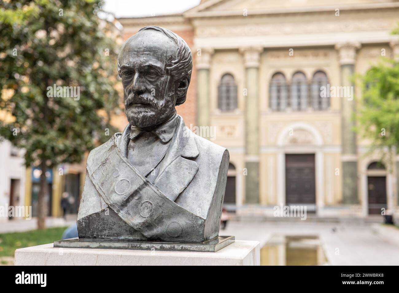 MODENA, ITALY - APRIL 21, 2022: Statue and bust of Giuseppe Mazzini in front of Synagogue of Modena, Italy Stock Photo