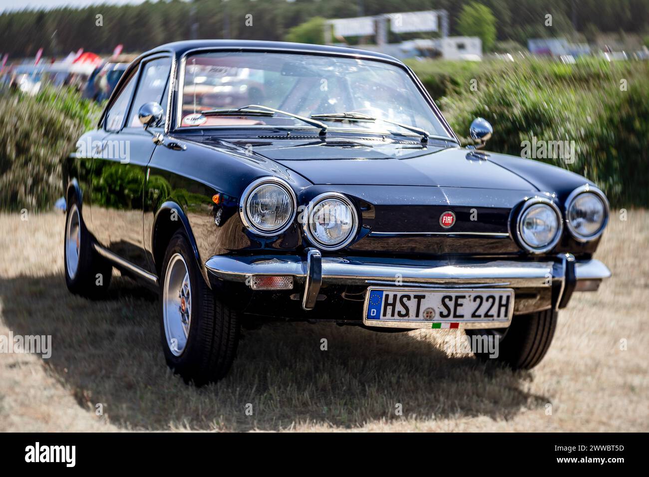 LINTHE, GERMANY - MAY 27, 2023: The supermini Fiat 850 Sport Coupe, 1971. Art lens. Swirl bokeh. Die Oldtimer Show 2023. Stock Photo