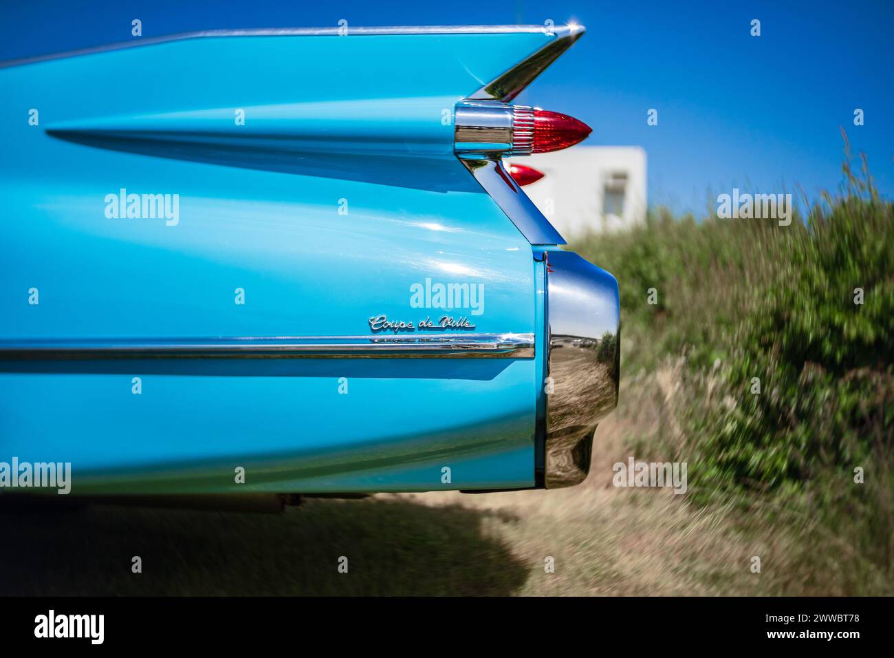 LINTHE, GERMANY - MAY 27, 2023: The detail of the rear wing and brake lights of the car Cadillac Coupe de Ville, close-up. Art lens. Swirl bokeh. Die Stock Photo