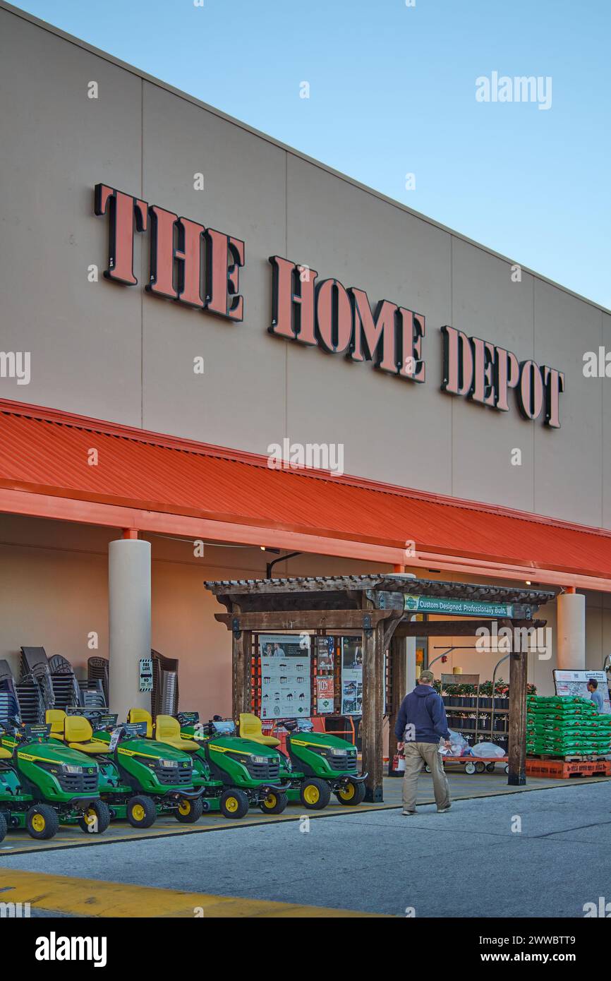 Florida, USA - March 23, 2024: Shot of a Home Depot store with a clear sky, showing the entrance filled with gardening tools and plants, inviting home Stock Photo