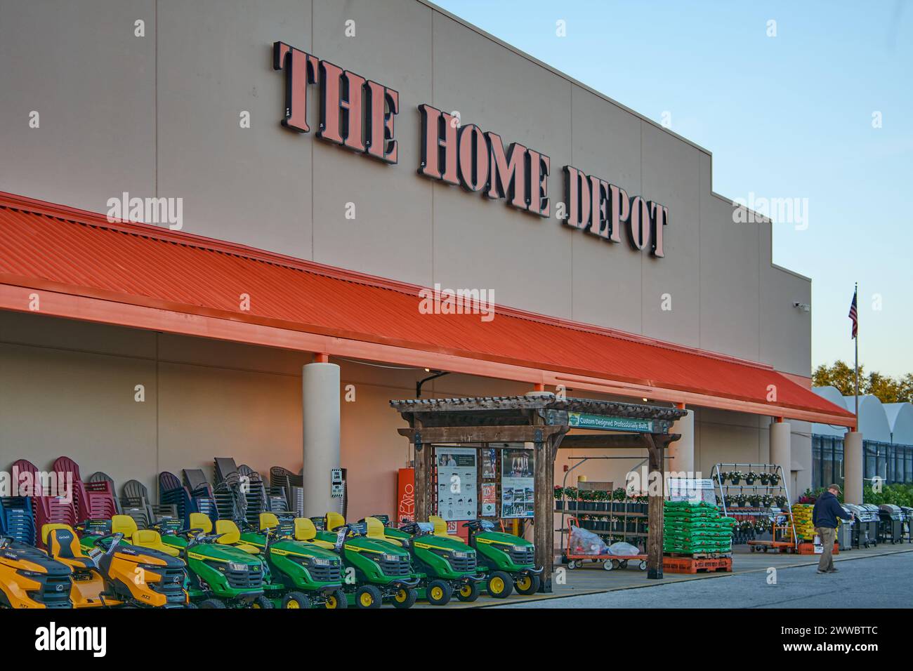 Florida, USA - March 23, 2024: Shot of a Home Depot store with a clear sky, showing the entrance filled with gardening tools and plants, inviting home Stock Photo