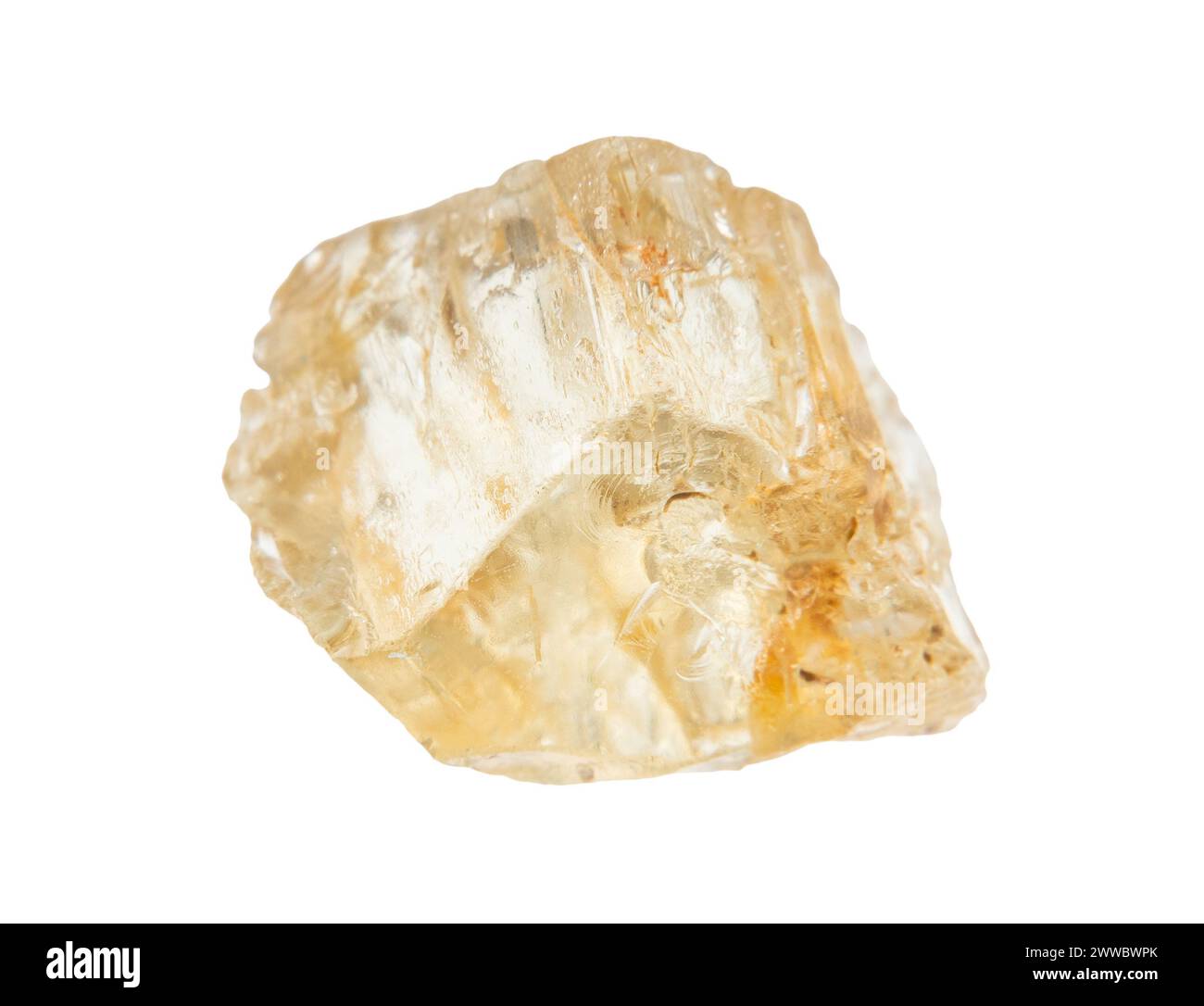 close up of sample of natural stone from geological collection - rough yellow scapolite crystal isolated on white background from Tajikistan Stock Photo