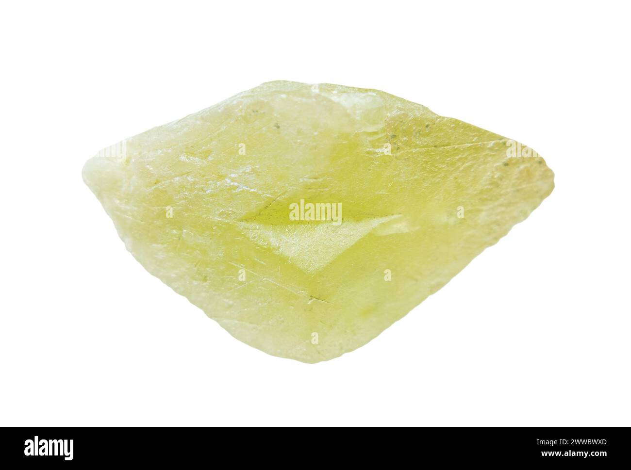 close up of sample of natural stone from geological collection - raw twinned green sphene crystal isolated on white background from Pakistan Stock Photo