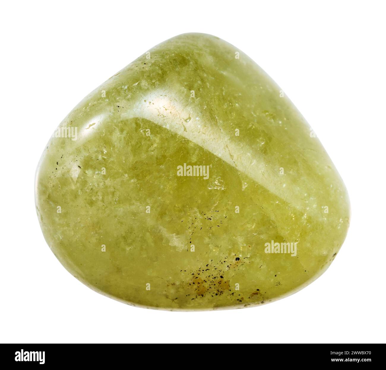 close up of sample of natural stone from geological collection - tumbled green grossular garnet gemstone isolated on white background from Mali Stock Photo