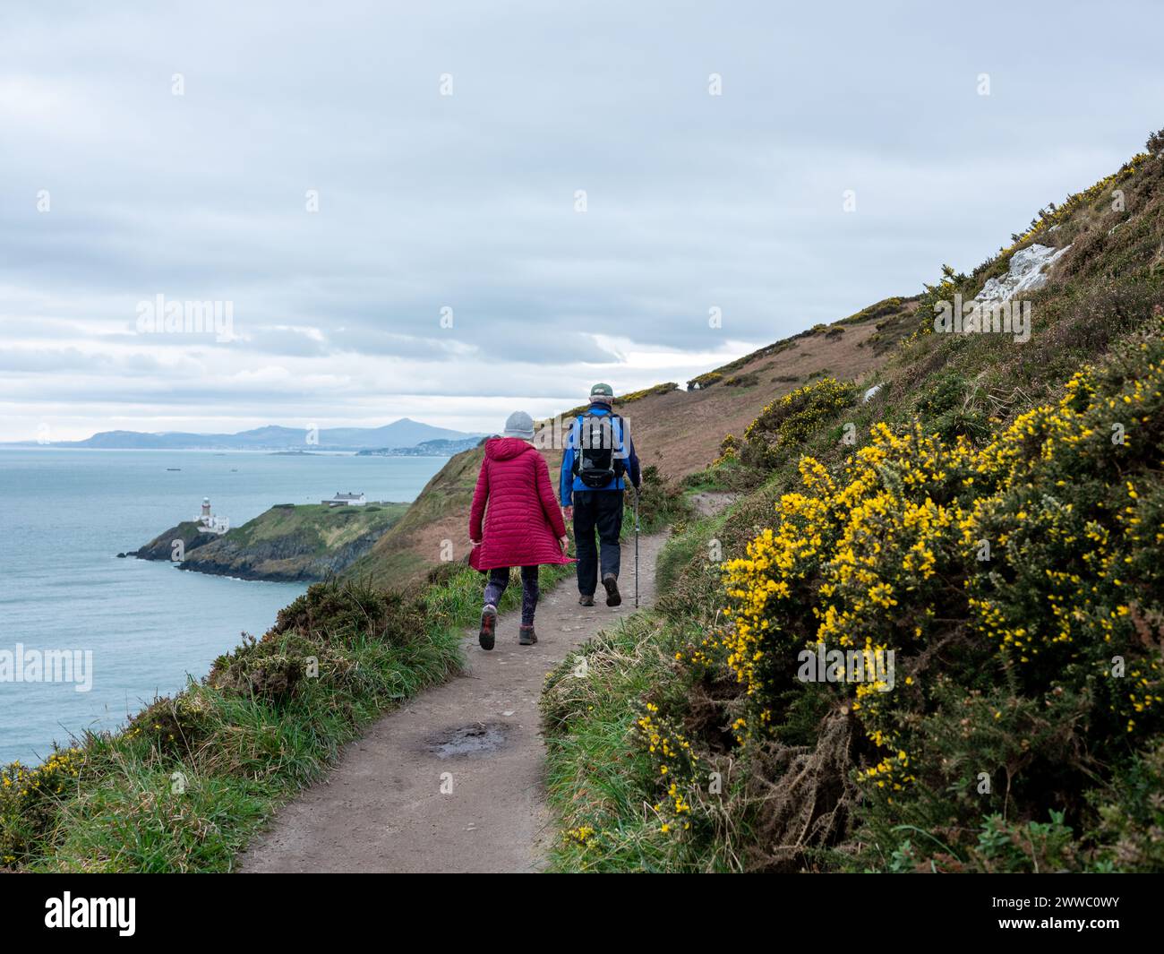 Walkers on the coastal path at Howth Head north of Dublin city, Ireland. Stock Photo