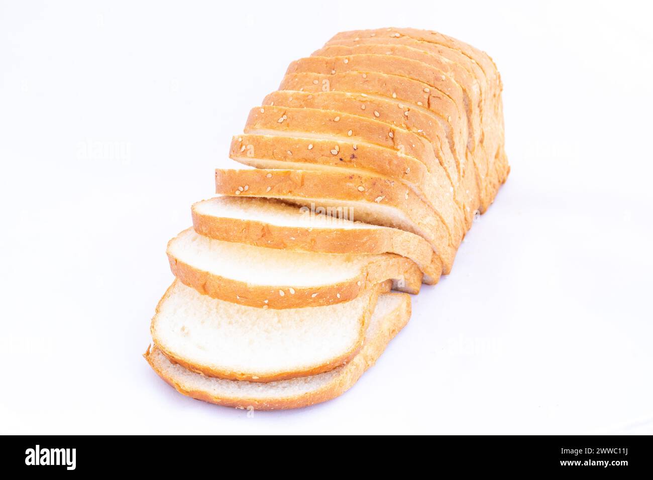 Sliced wheat bread on a white isolated background Stock Photo - Alamy