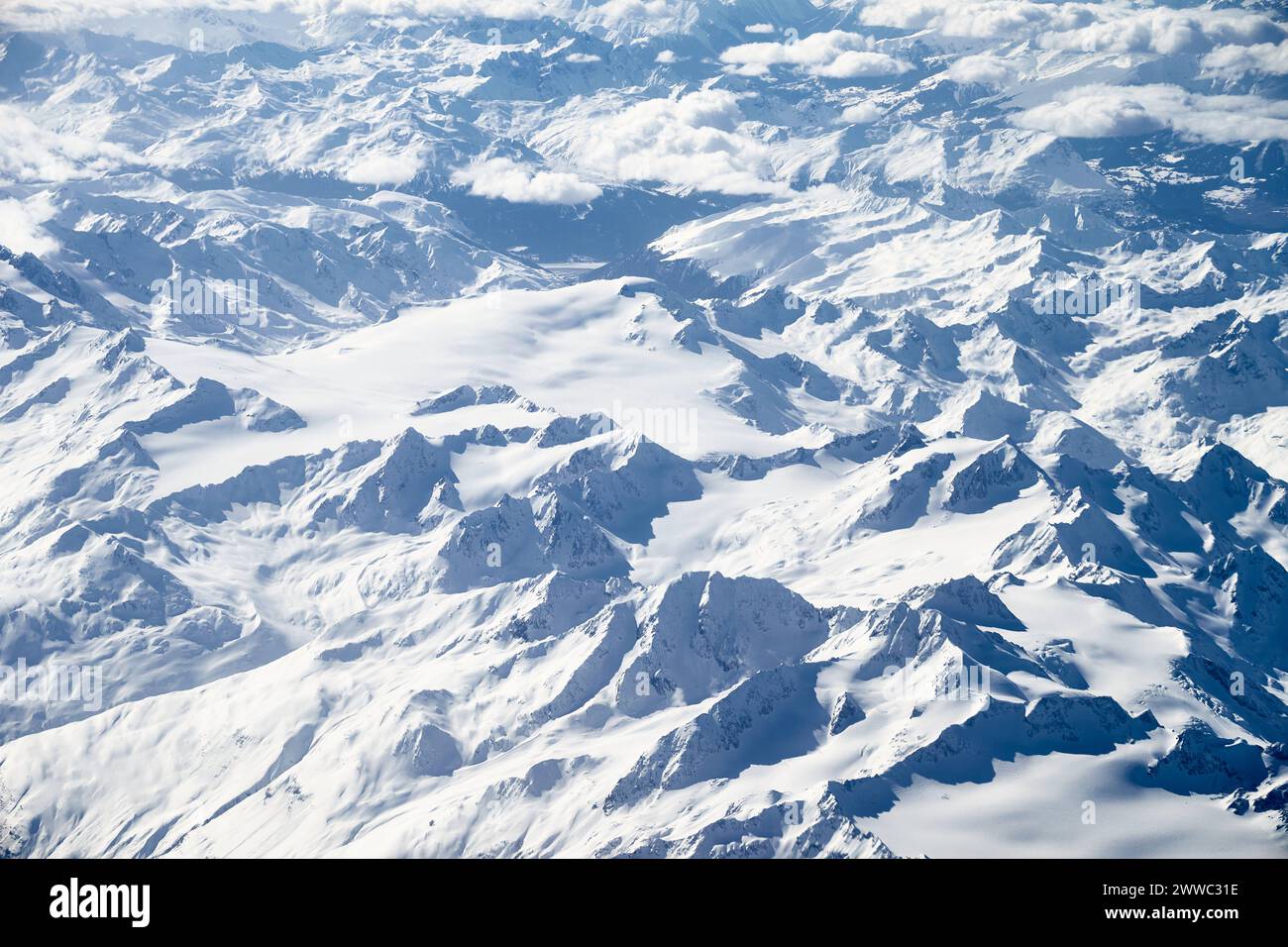 4 March 2024: Aerial view of the snow-covered mountains in the Alps ...