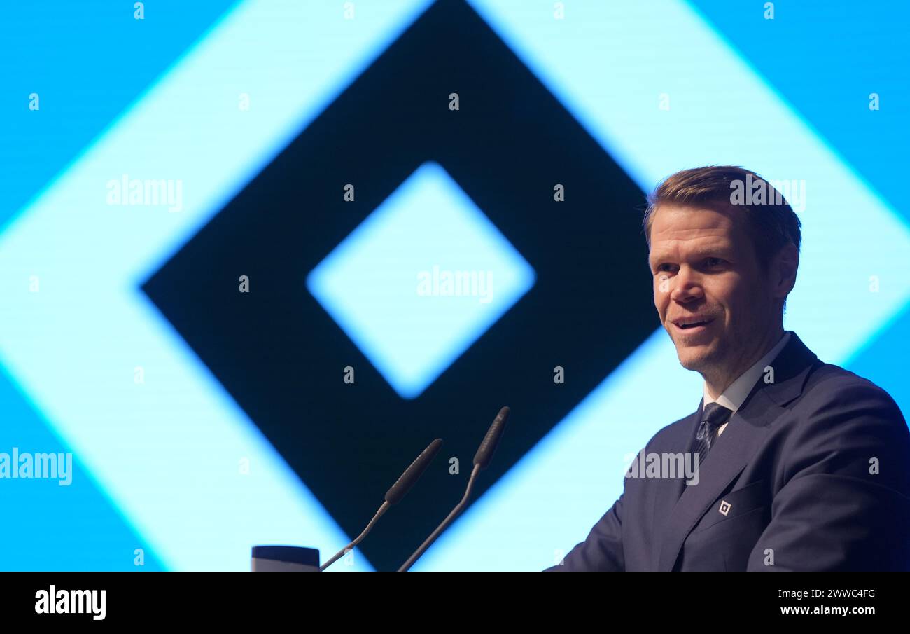 Hamburg, Germany. 23rd Mar, 2024. Soccer: Bundesliga 2, Extraordinary General Meeting of Hamburger SV in the Edel-Optics.de Arena. Hamburg's Eric Huwer, CEO of HSV Fußball AG, speaks on the podium. The members decide on the motion to change the legal form of HSV Fußball AG to HSV Fußball AG & Co. KGaA. Credit: Marcus Brandt/dpa/Alamy Live News Stock Photo