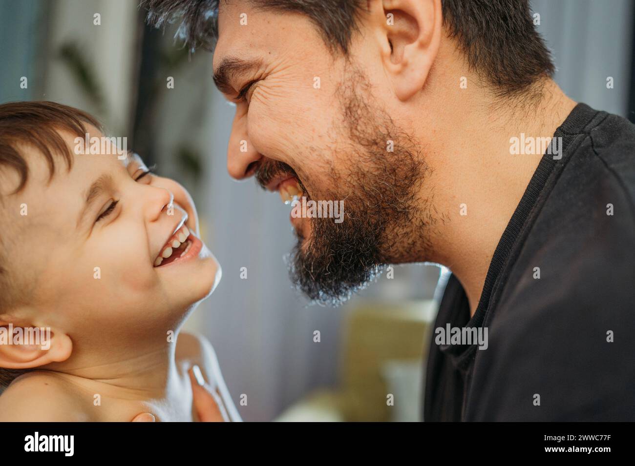 Cheerful father and son having fun at home Stock Photo - Alamy