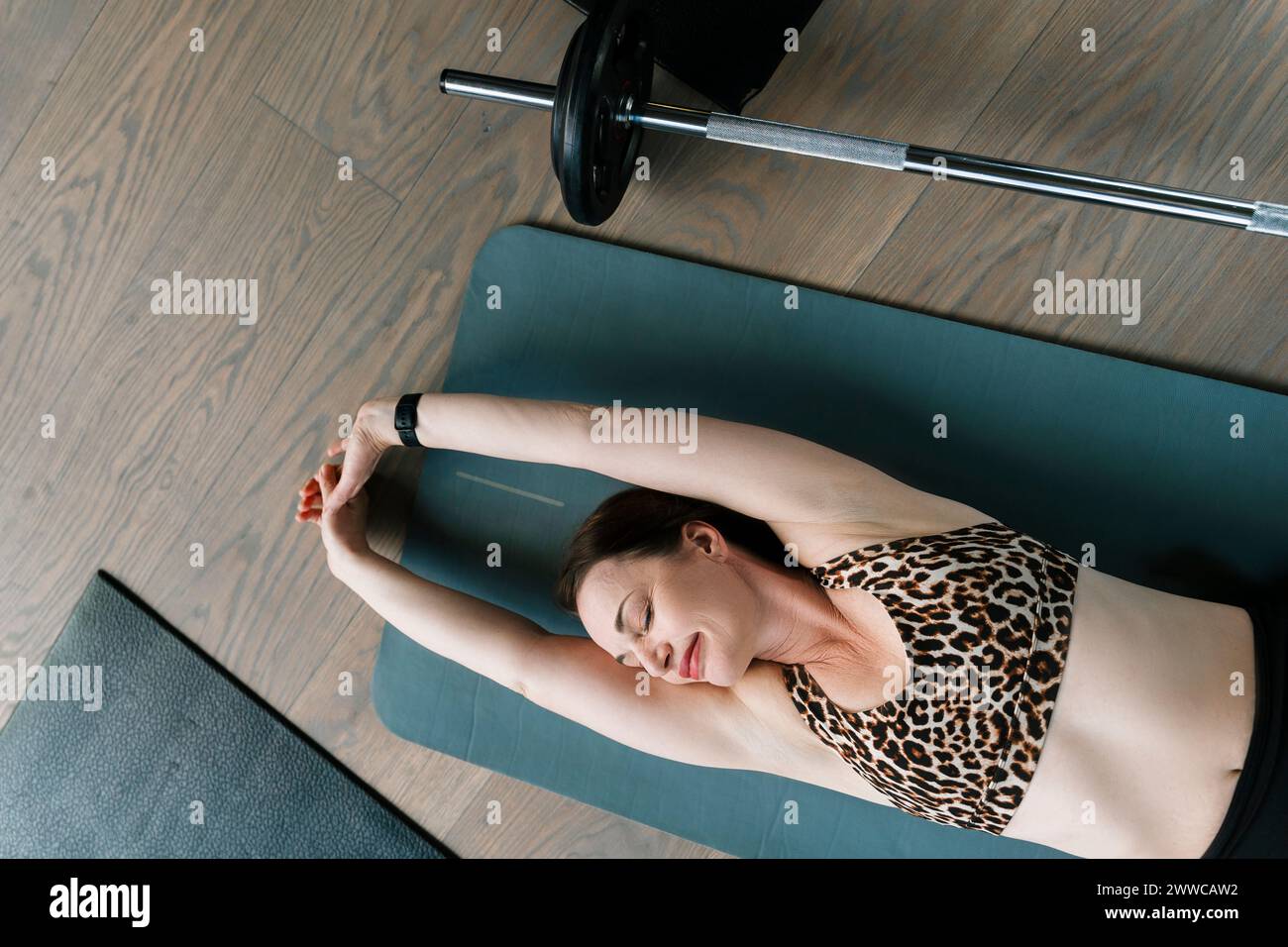 Woman stretching arms above head hi-res stock photography and images ...