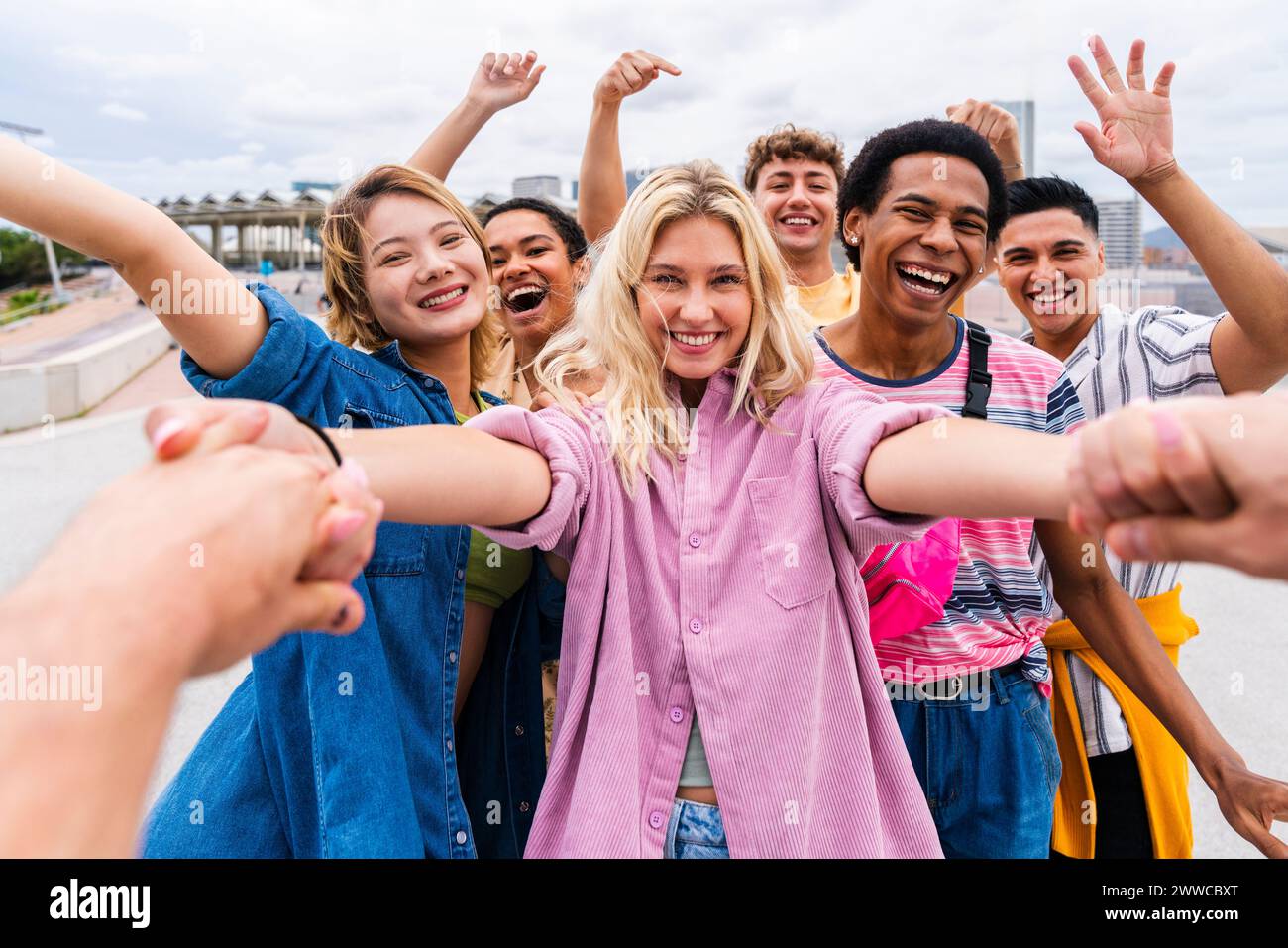 Hand Fun Happy young friends holding hands and having fun together Stock Photo ...