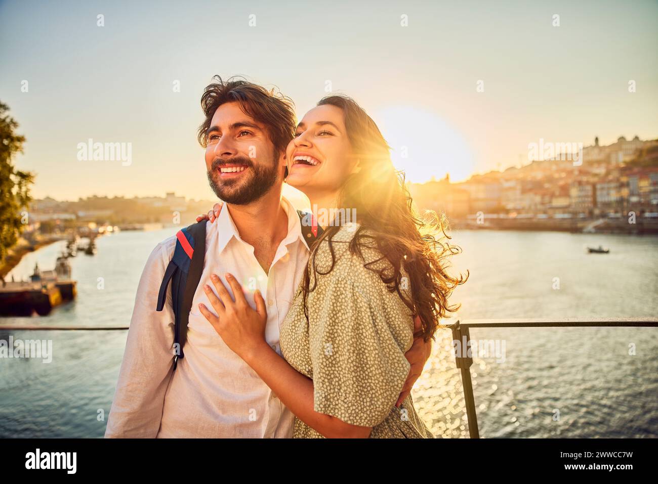 Happy young couple standing together Stock Photo