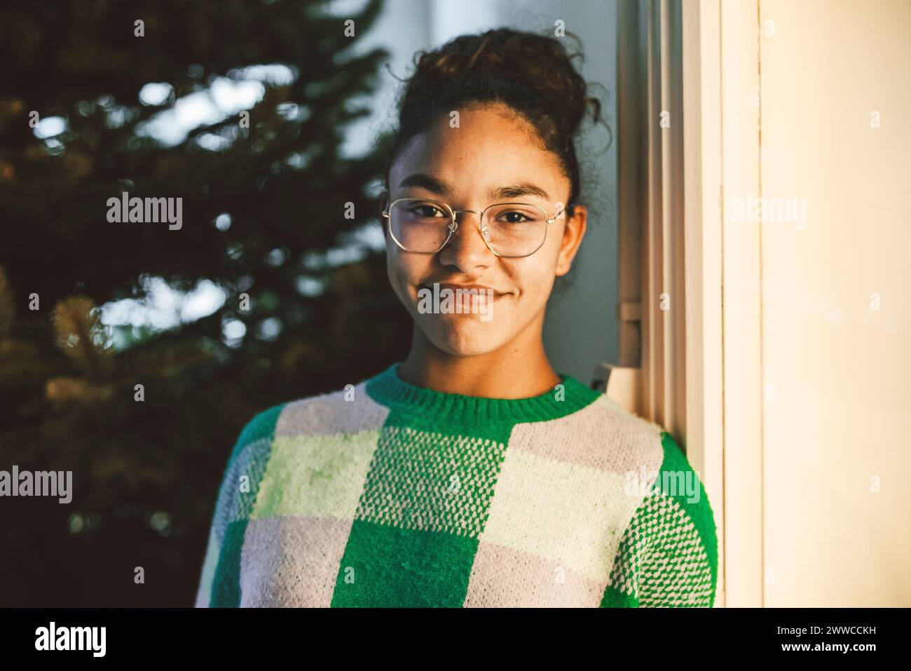 Smiling young woman wearing eyeglasses Stock Photo