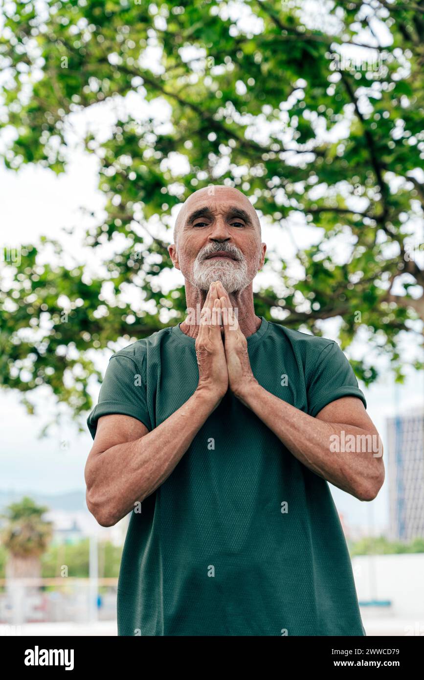 Elderly man clasped hands hi-res stock photography and images - Alamy