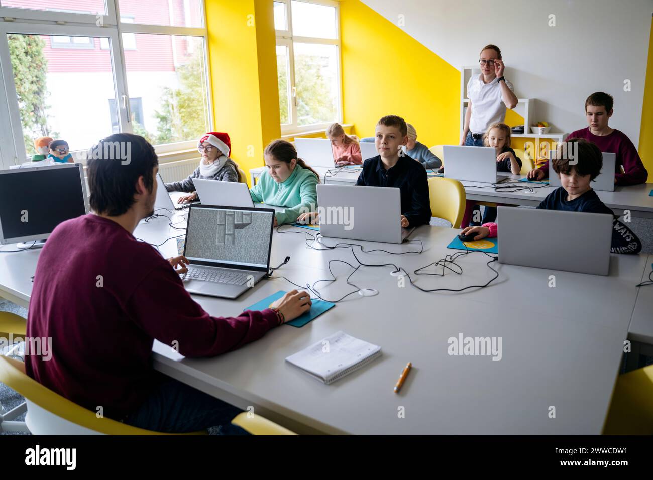 Students learning coding through laptops in classroom Stock Photo - Alamy