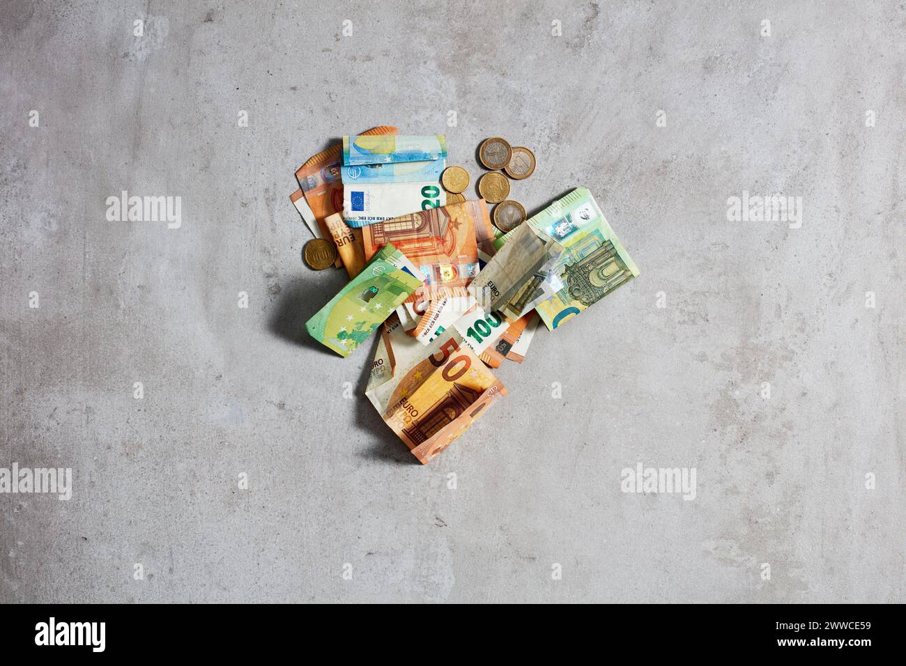 Euros lying on gray surface Stock Photo