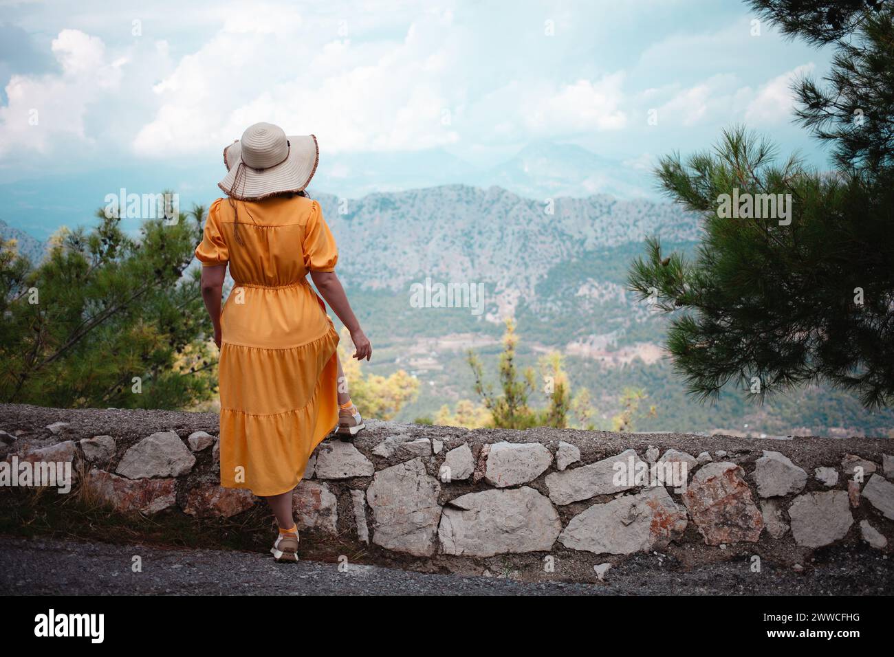 Vibrant yellow dressed woman hi-res stock photography and images - Alamy