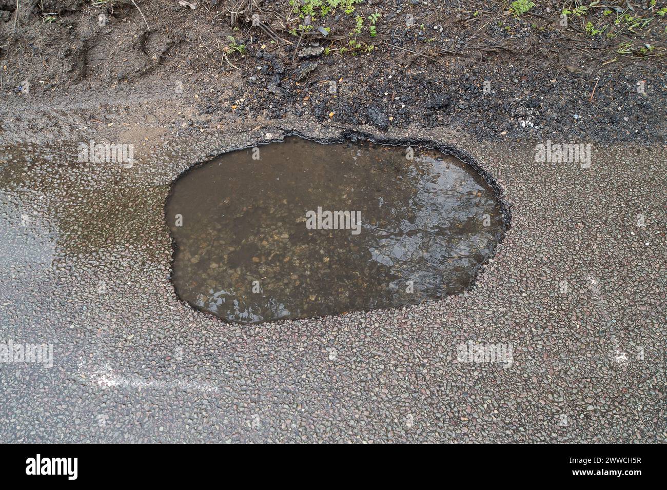 Slough, UK. 21st March, 2024. Water has been flowing out of a manhole