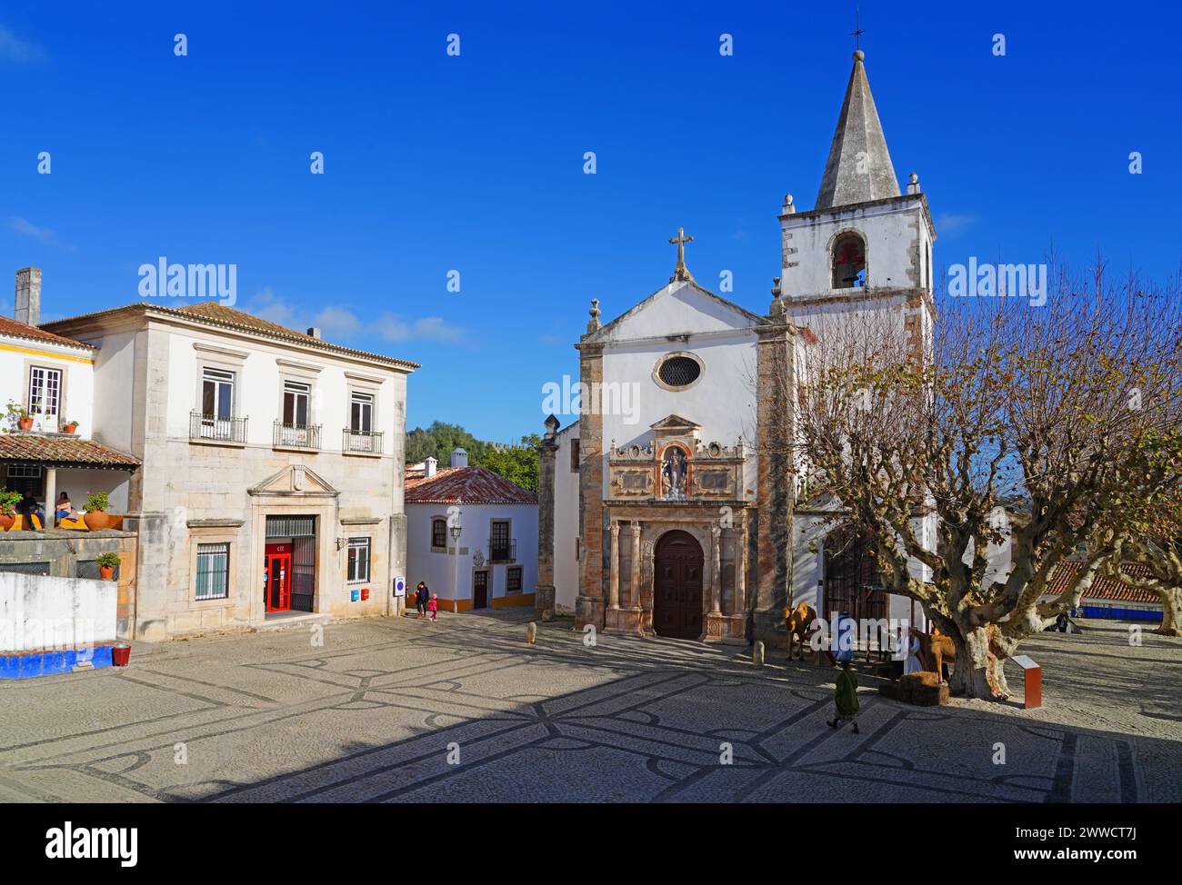 OBIDOS, PORTUGAL -21 DEC 2023- Day view of Obidos, a historic medieval town with a castle and fortress walls in the Oeste region of Portugal. Stock Photo