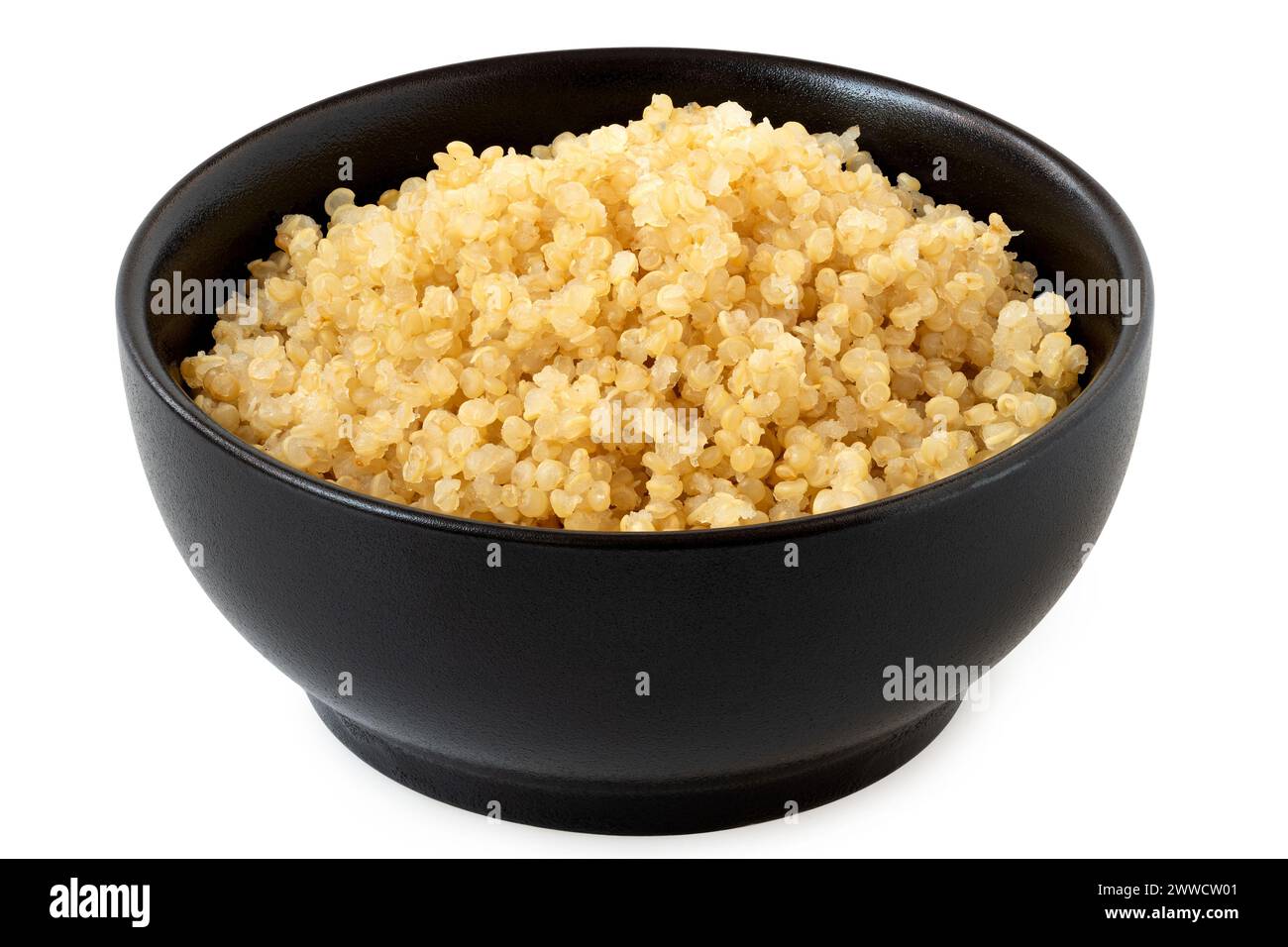 Cooked white quinoa in a black ceramic bowl isolated on white. Stock Photo
