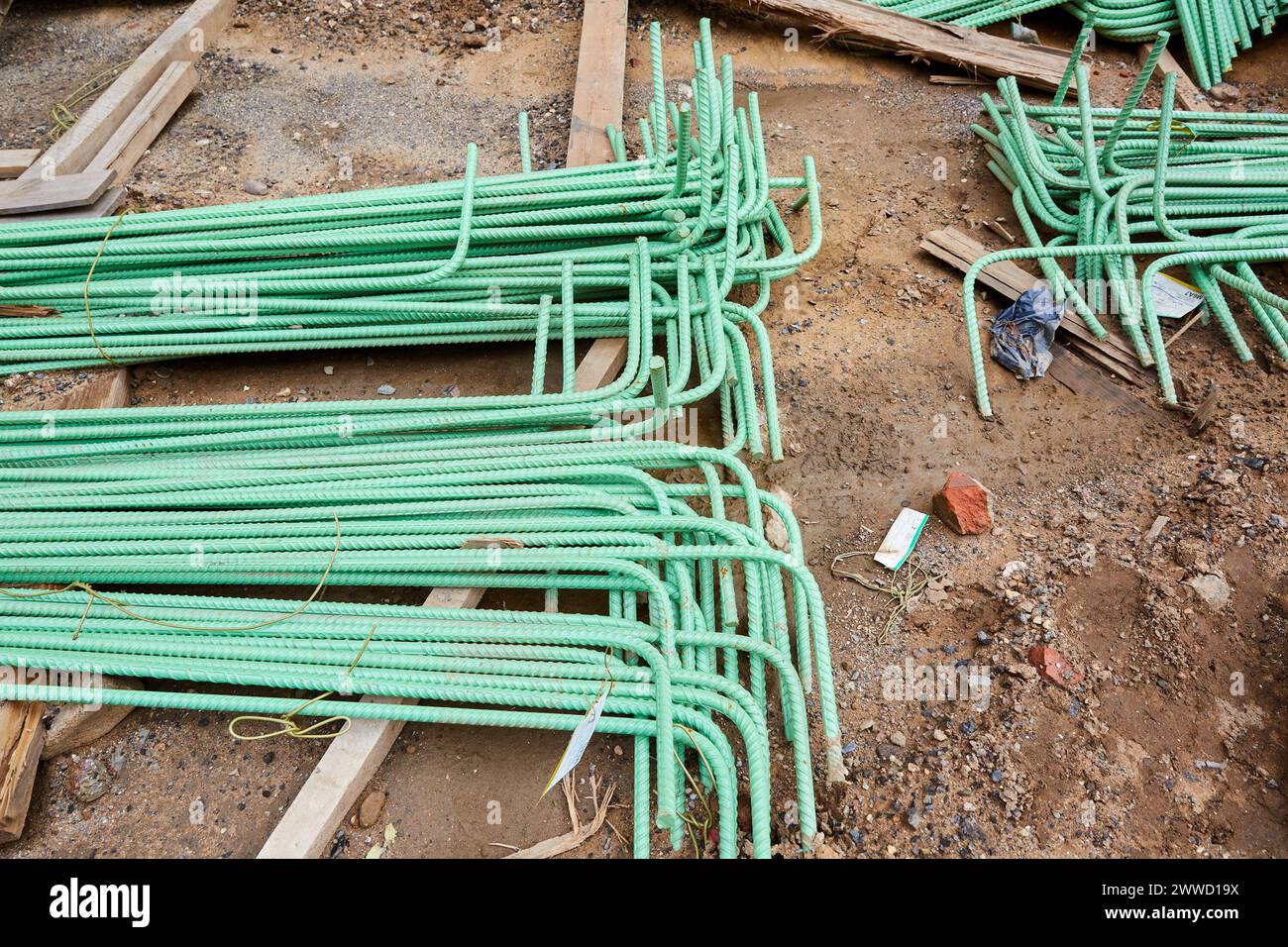 Piles of Right Angle Rebar on the Ground at Construction Site Stock Photo