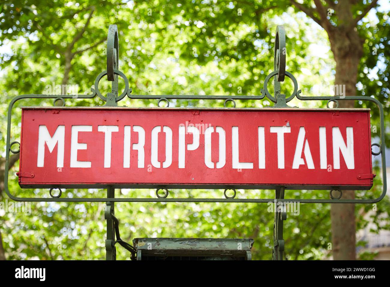 Red Paris Metropolitan Sign with Wrought Iron Frame Stock Photo
