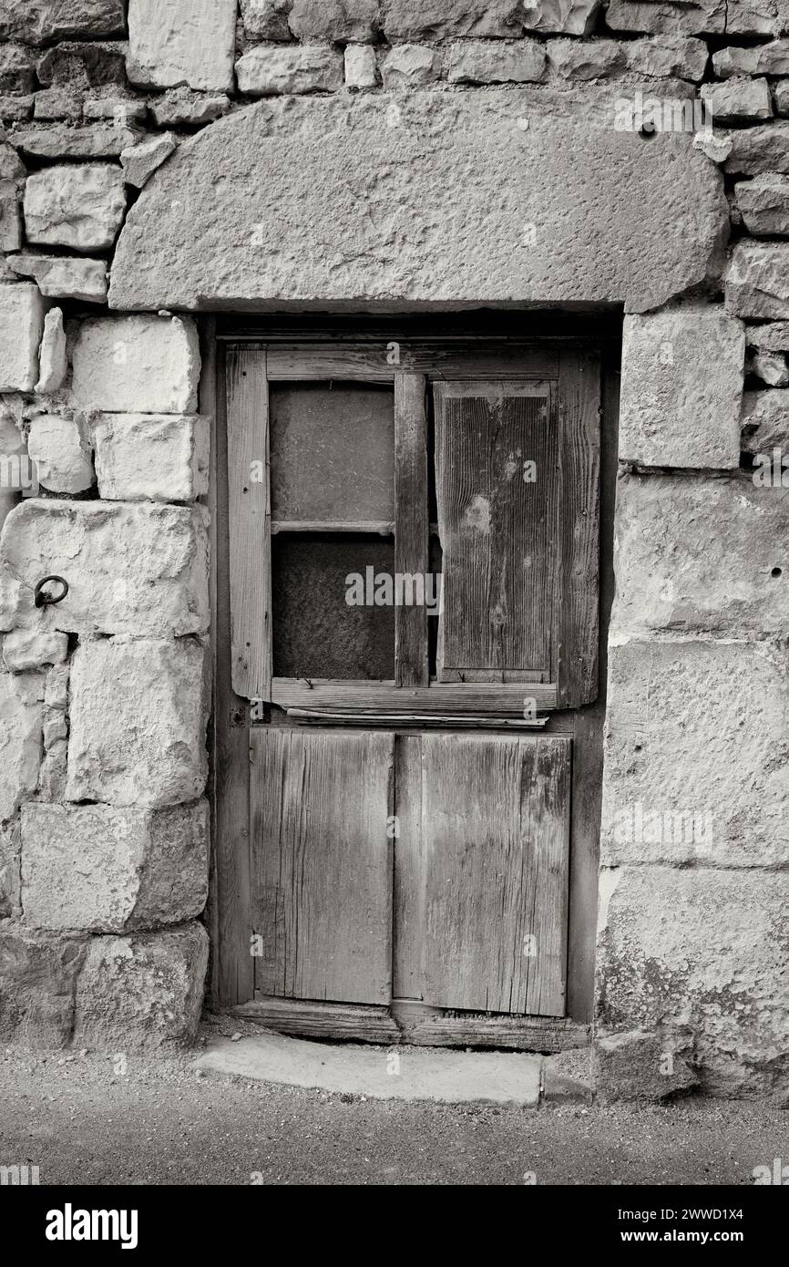 Gray Wooden Door with Missing Window Stock Photo