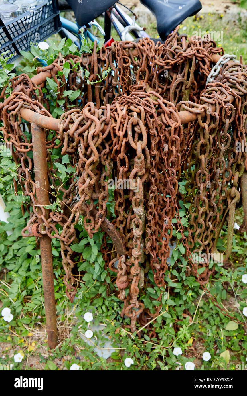 Rusty Chains Hanging on a Metal Loop Stock Photo