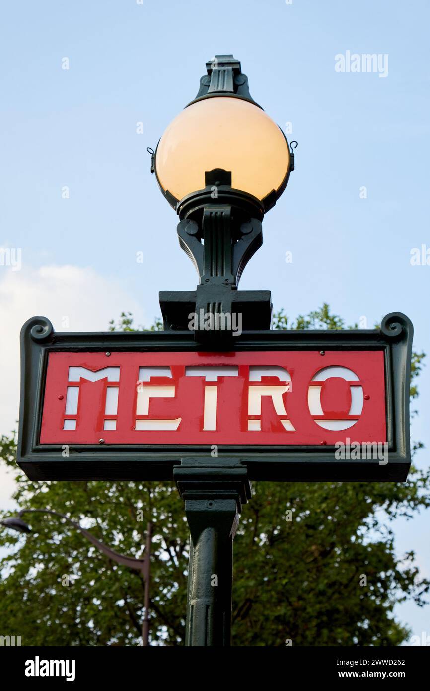 Lit Globe on Iron Pole with Sign for Paris Metro Subway Stock Photo