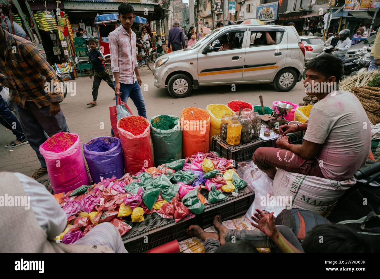 Guwahati, Assam, India. 23rd Mar, 2024. Vendor sells Holi celebration items in a street market, ahead of Holi festival on March 23, 2024 in Guwahati, Assam, India. Holi is the Hindu festival of colours, it is celebrated with great joy in India. Credit: David Talukdar/Alamy Live News Credit: David Talukdar/Alamy Live News Stock Photo